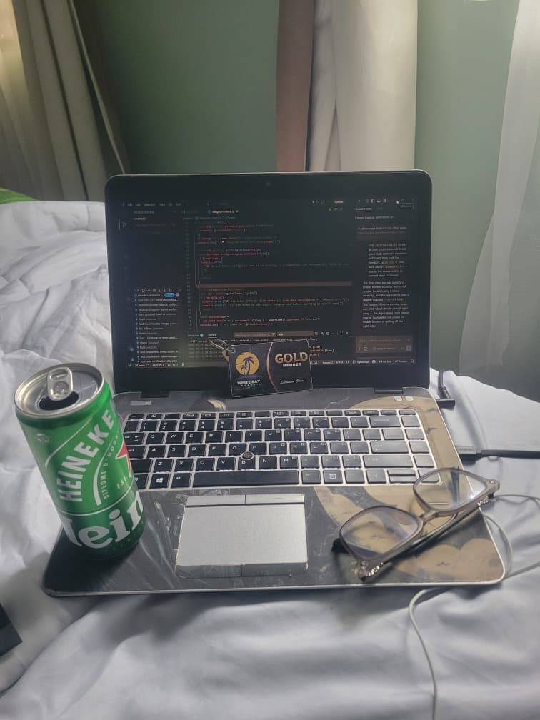 Ballmer Peak — A Heineken, a screen full of code, glasses resting on the trackpad. I like to sip and code. From the Jedidiah Gabriel (Jedshock) gallery.
